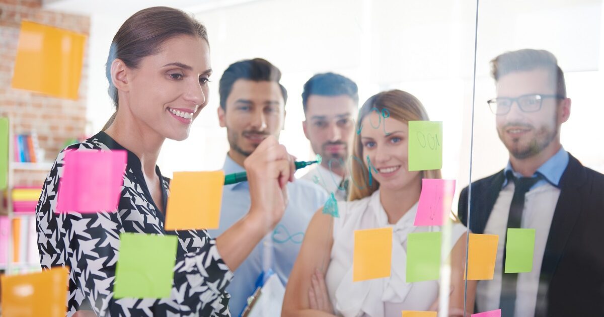 Office workers and colorful papers